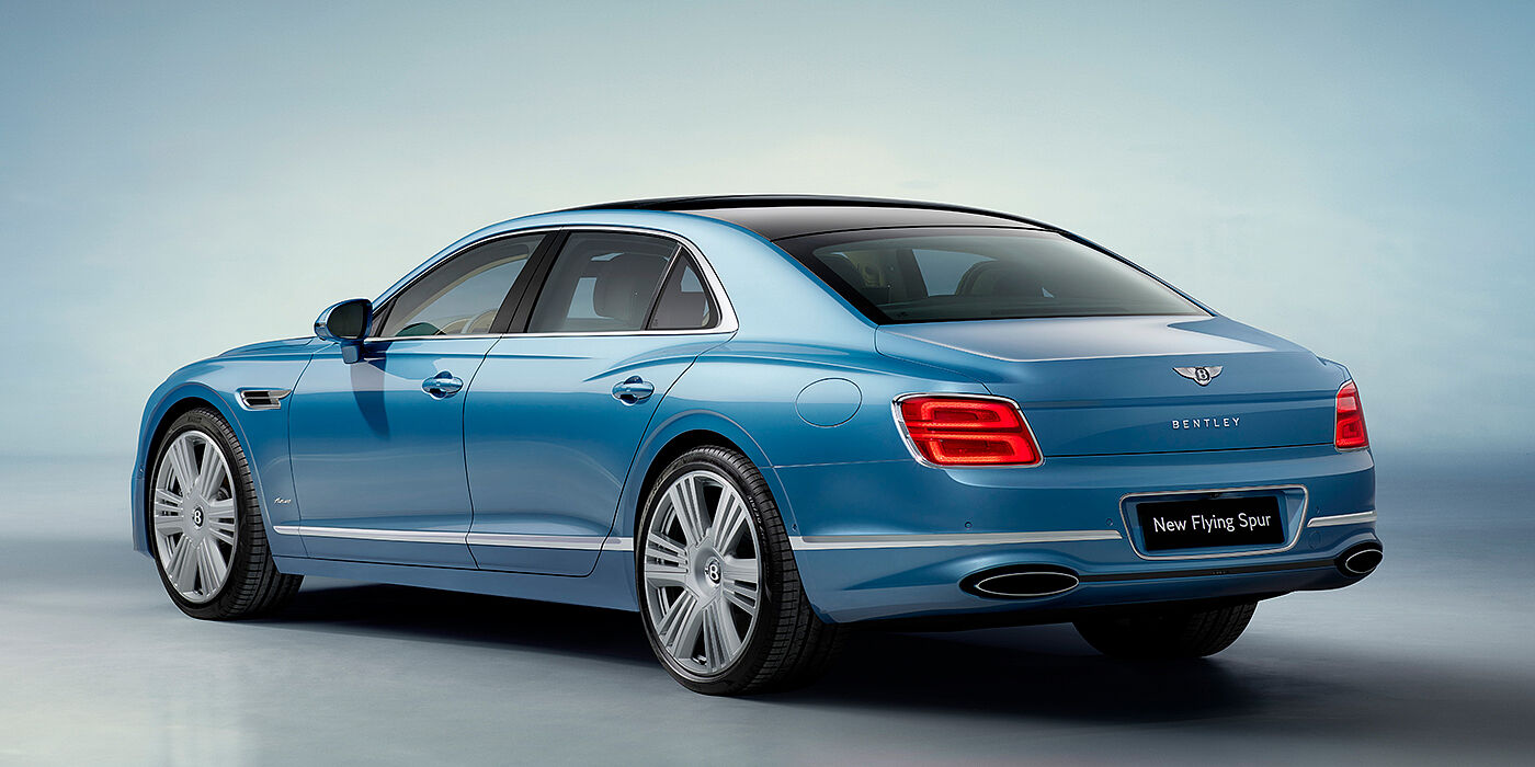 JCT600 Limited New Bentley Flying Spur Azure sedan rear view in Light windsor blue by Mulliner paint with 22 inch Azure wheels and chrome exterior details
