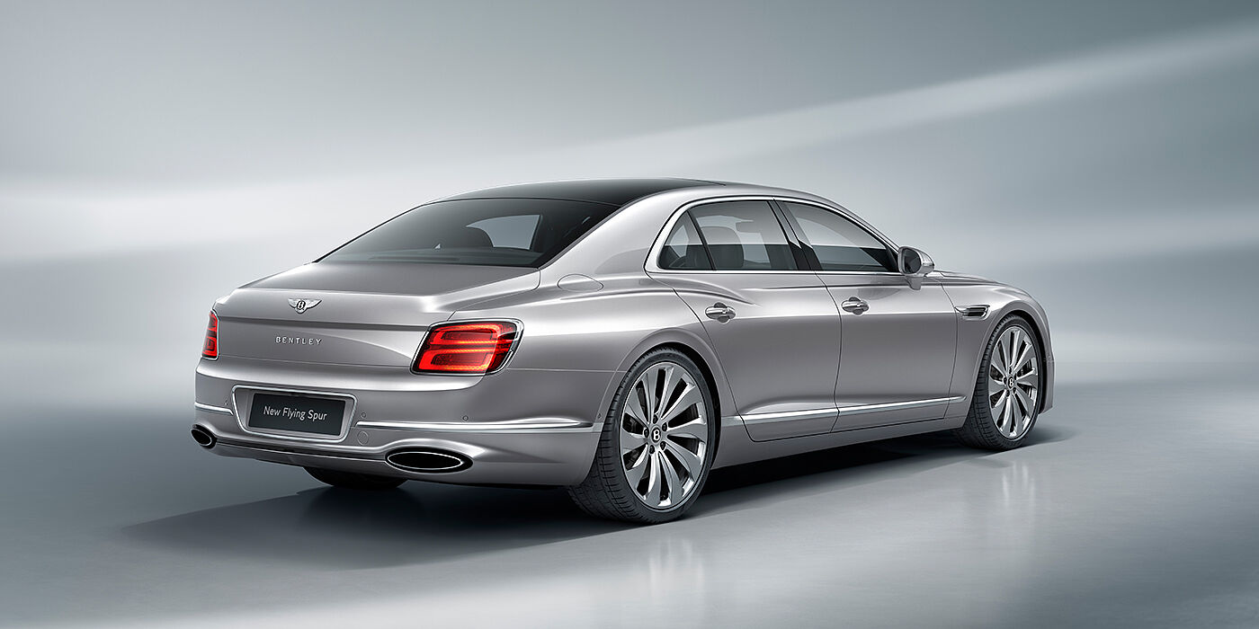 JCT600 Limited New Bentley Flying Spur sedan rear view in Silverlake paint with ten spoke wheels and chrome matrix grille